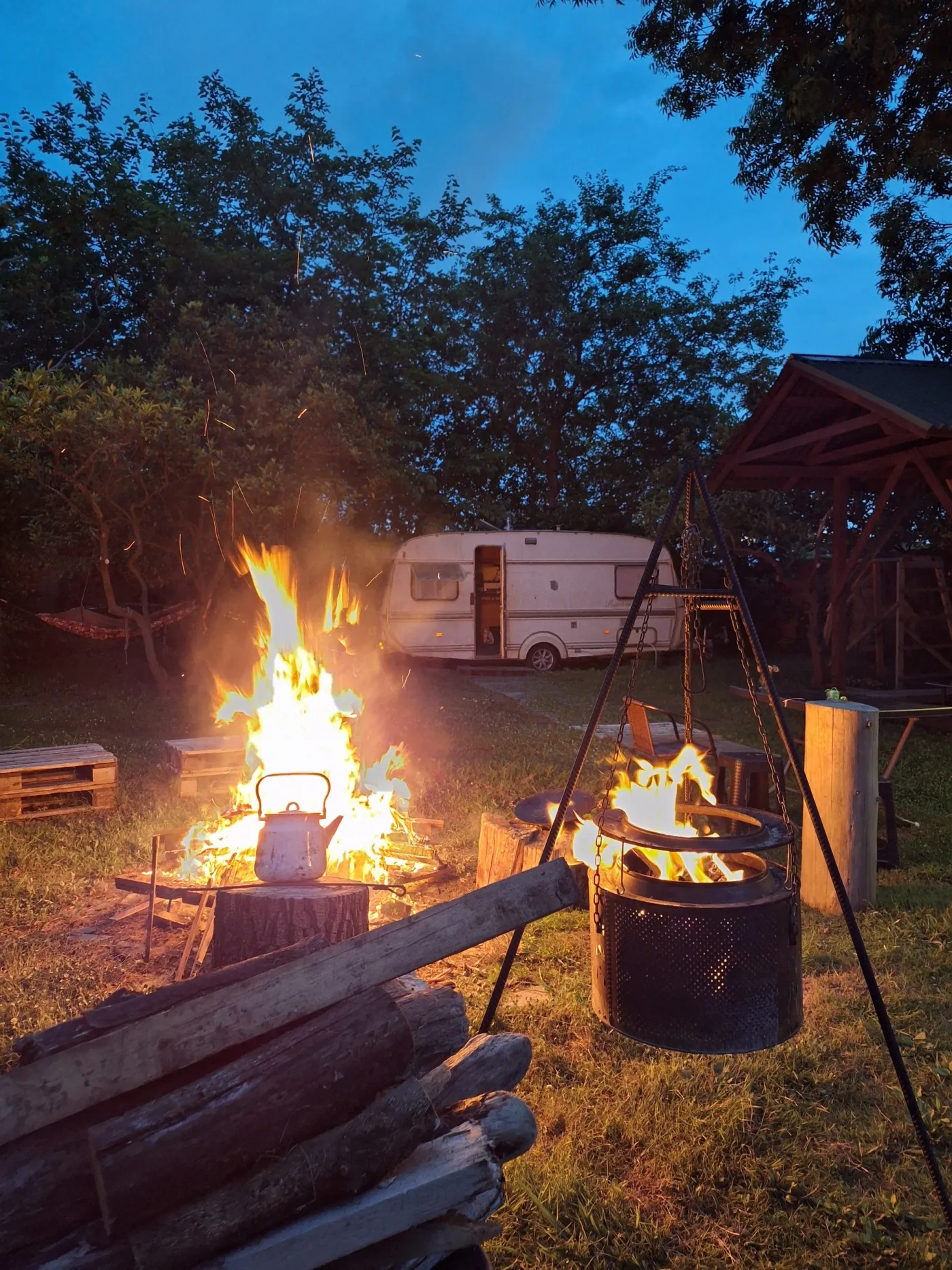 Fire pit at night by the caravan